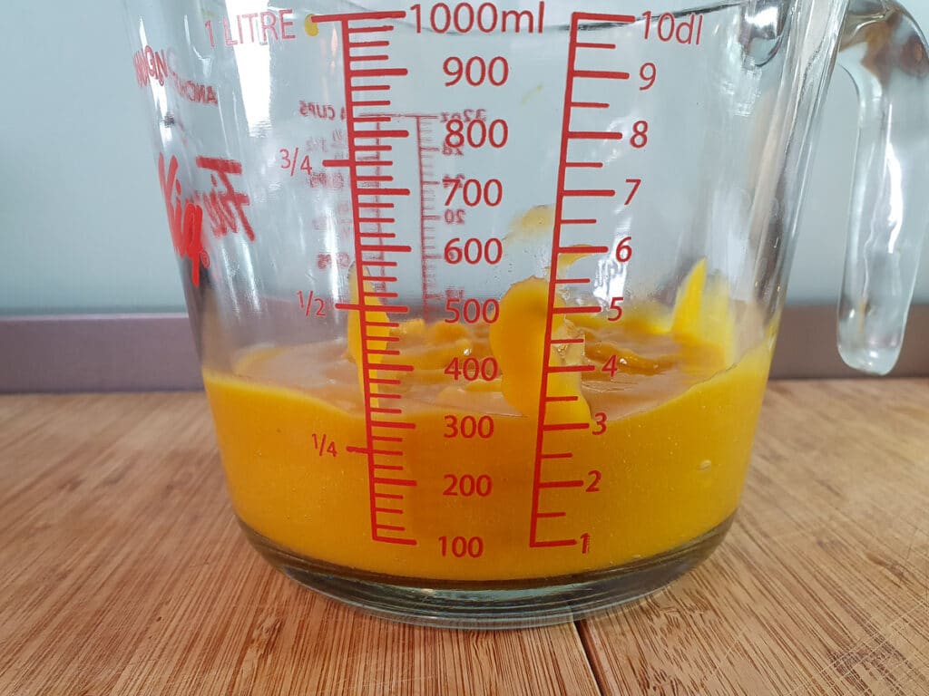Jug showing about 300 mls mango puree.