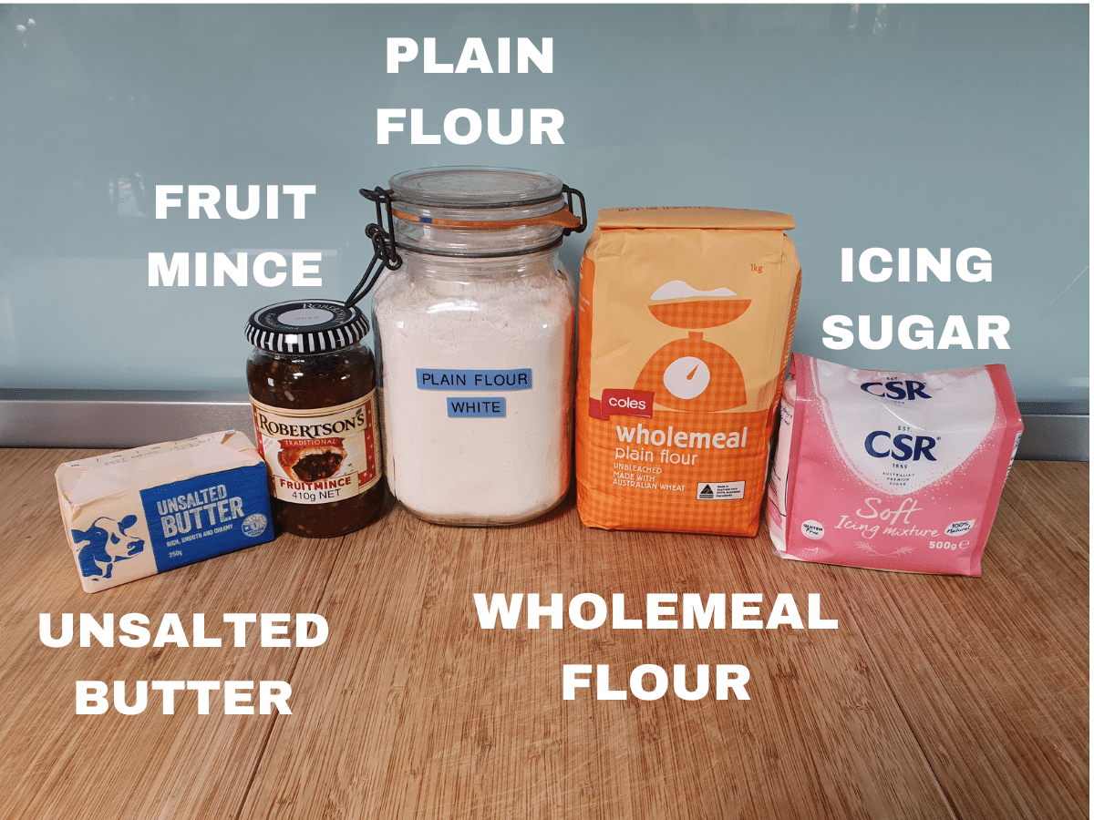 Mincemeat tarts ingredients, unsalted butter, jar of fruit mince, plain four, wholemeal flour, icing sugar.