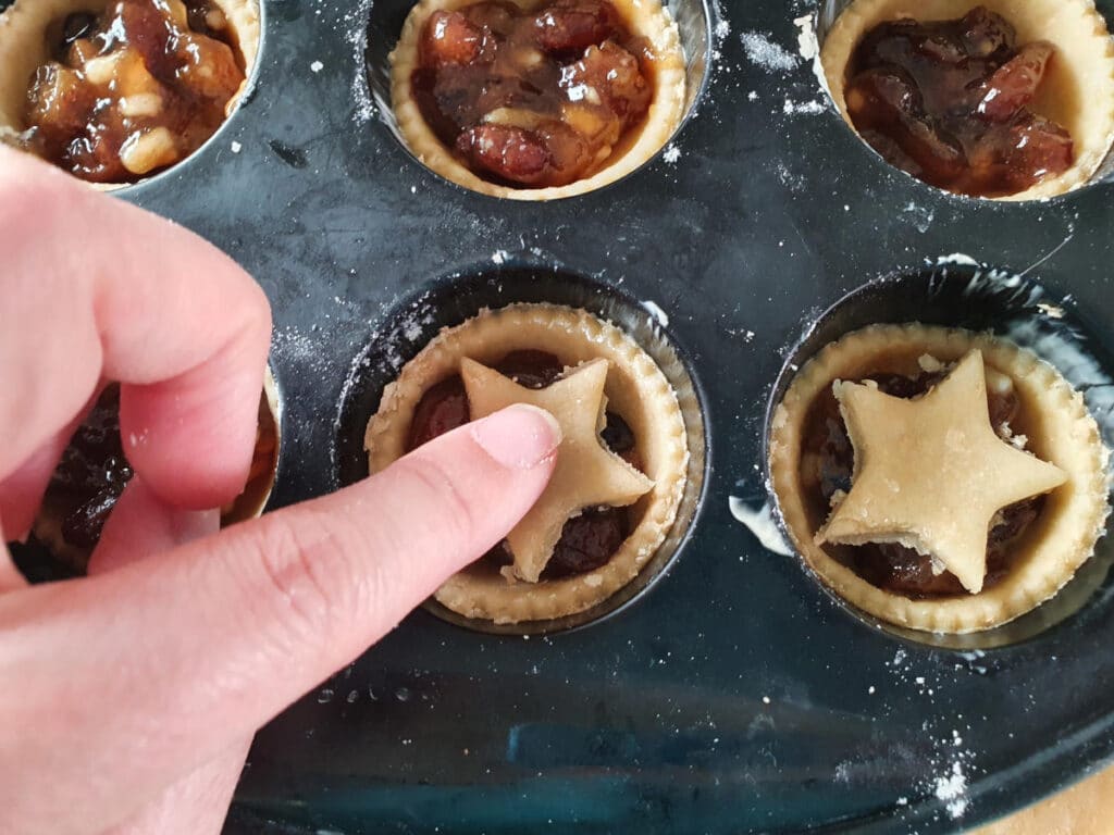 adding star tops to tarts.