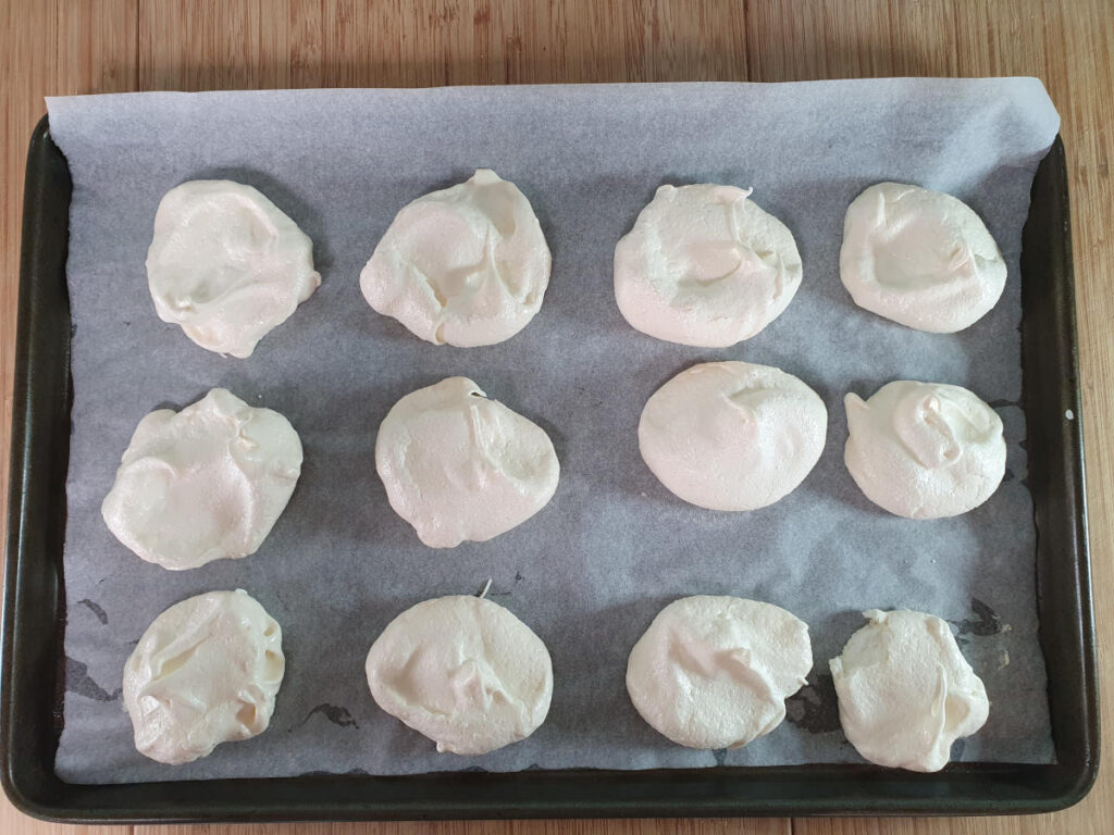 baked meringues on tray.