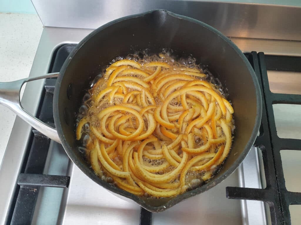 bringing peel and sugar syrup to boil.