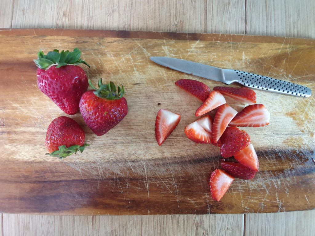 chopping strawberries.