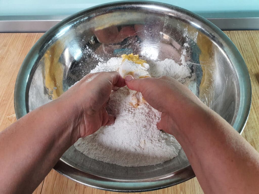 rubbing the butter into the dry ingredients with your hands.