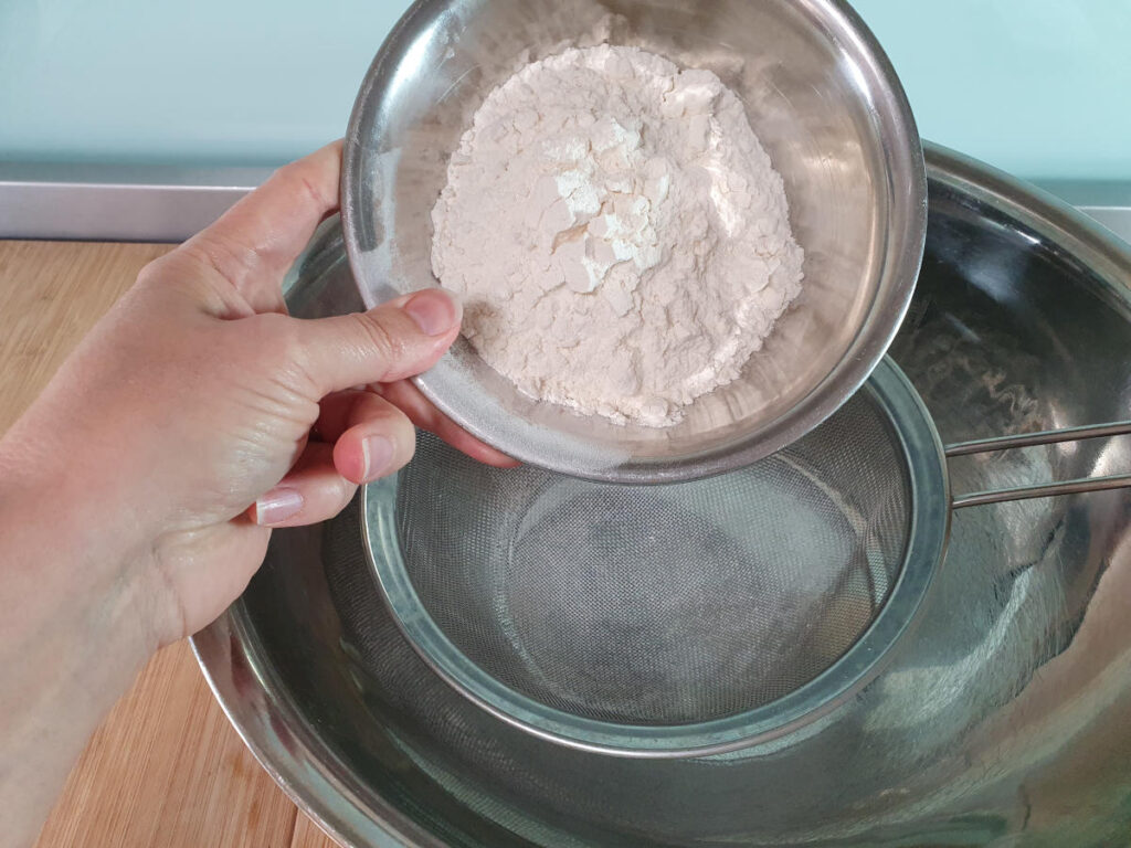 Mincemeat tarts 5 sifting in plain flour.