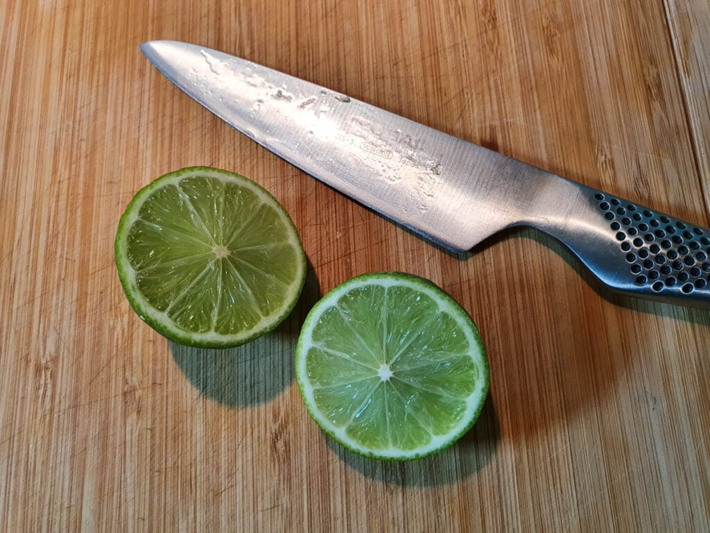 Pina colada popsicles 6 slicing lime ready to juice.