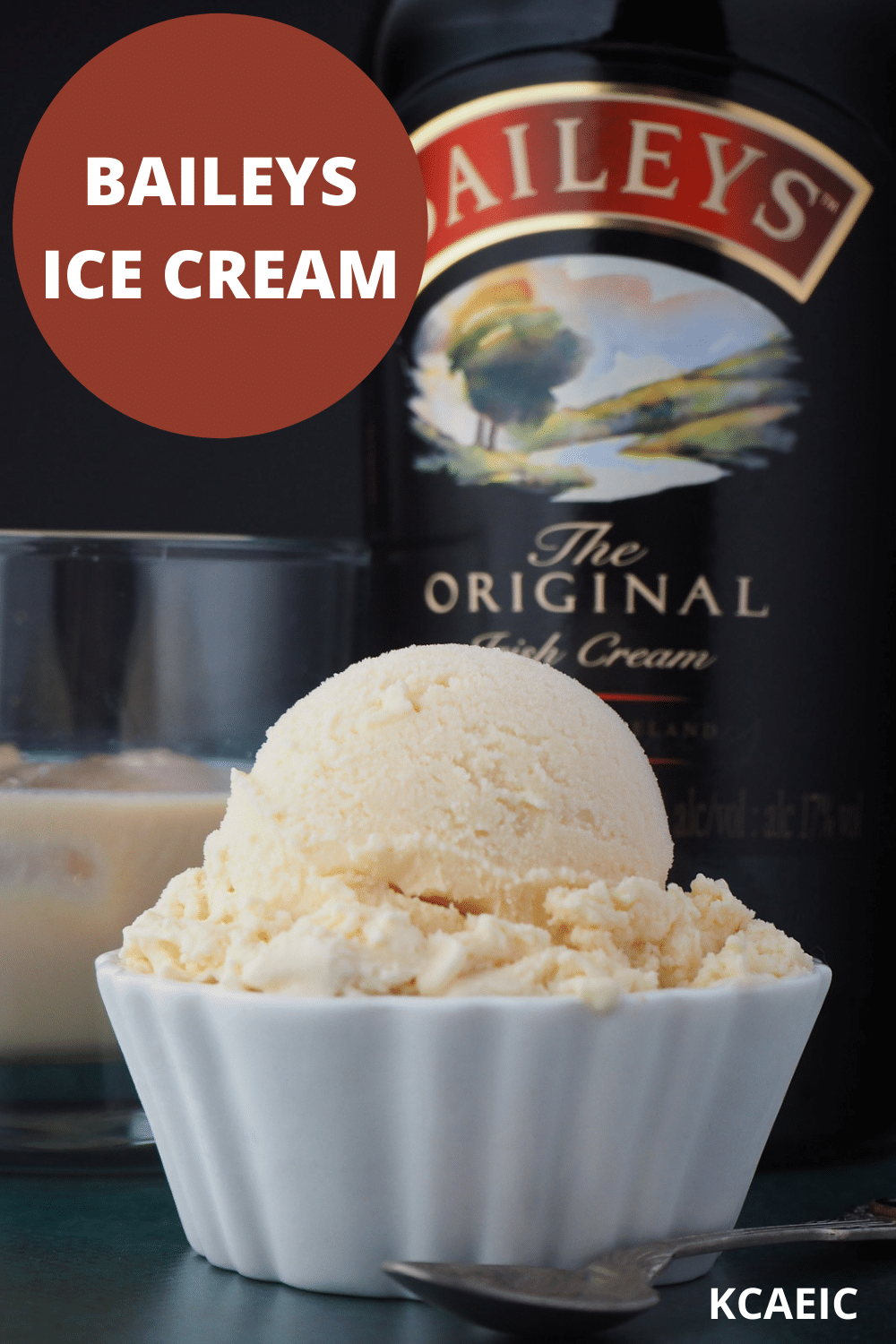 Close up Baileys ice cream scoop with glass of Baileys and bottle of Baileys in the background and text overlay, Baileys ice cream, KCAEIC.