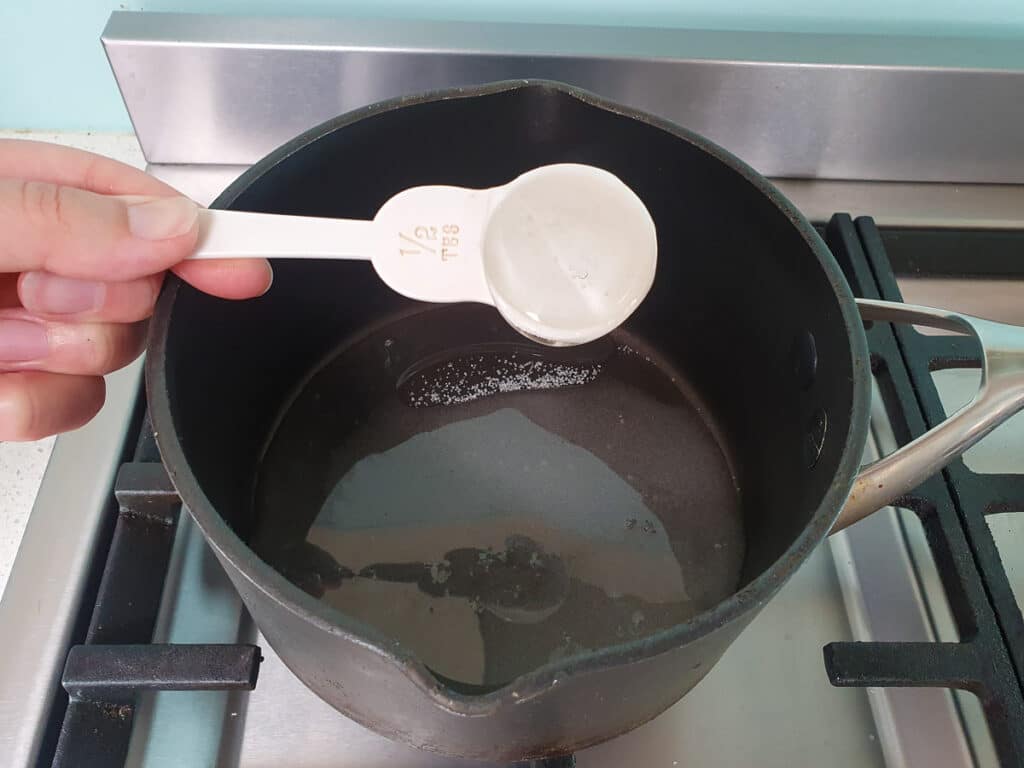Lamington ice cream 22 Adding glucose syrup to pot for strawberry sauce.