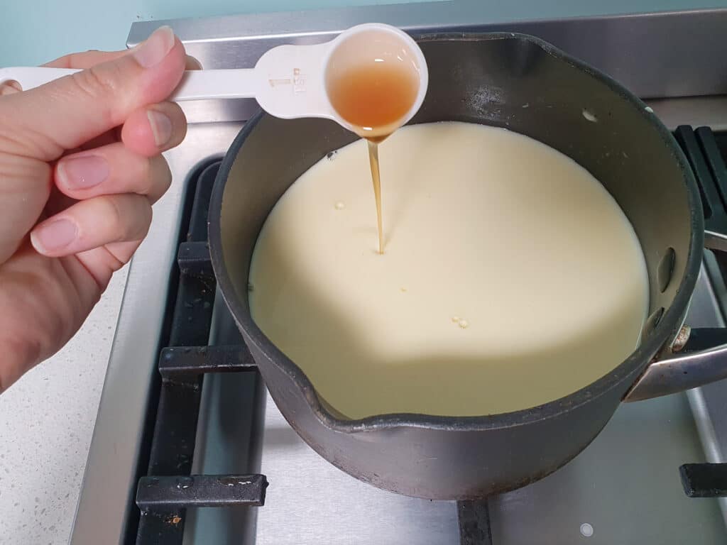 Adding vanilla to ice cream mix.