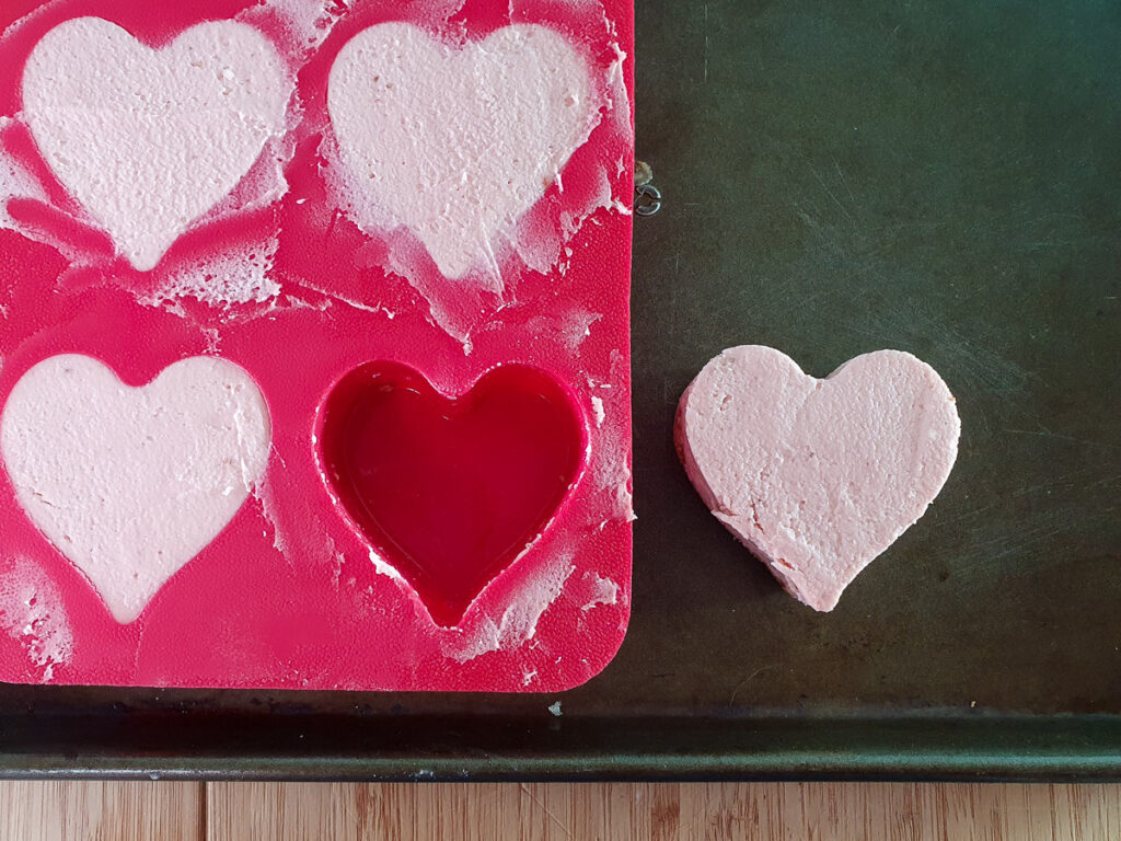 Cheesecake removed from heart shaped mold.