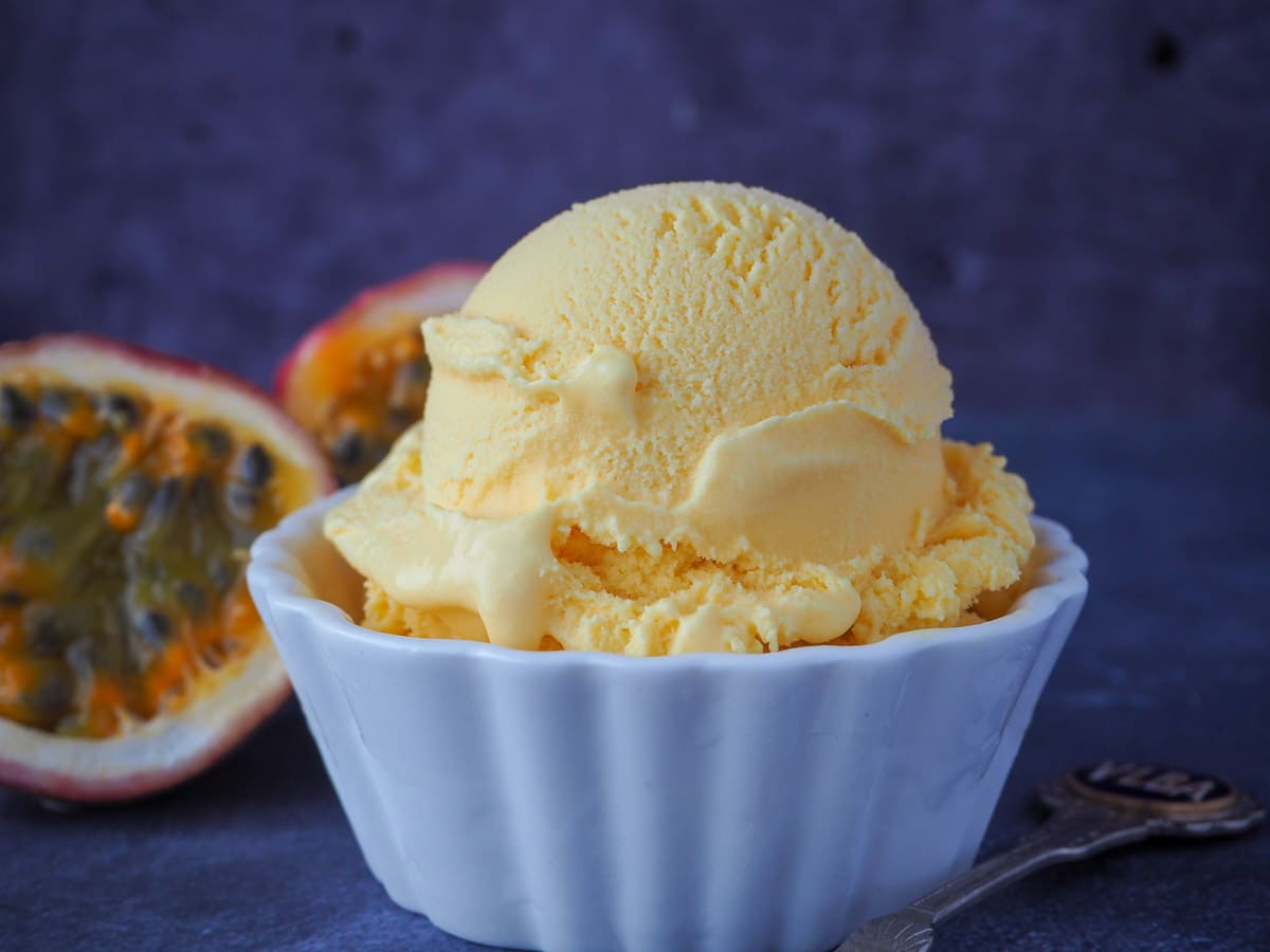 Passion fruit ice cream with fresh passion fruit and a vintage spoon.
