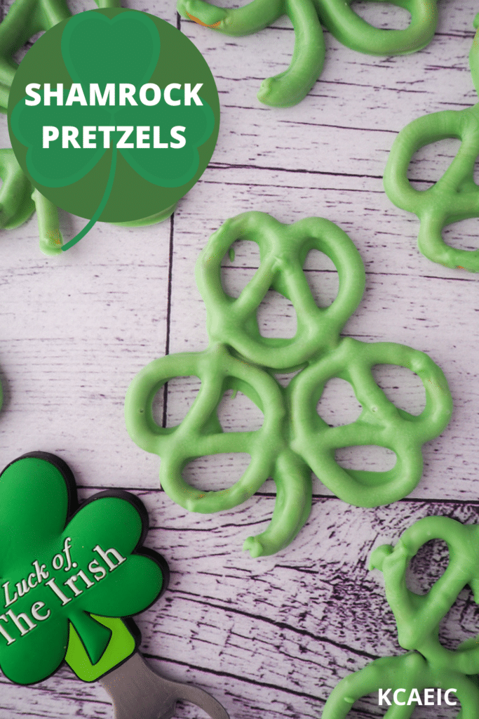 Shamrock pretzels with shamrock figurine with 'Luck of the Irish' written on it and text overlay, Shamrock pretzels and KCAEIC.