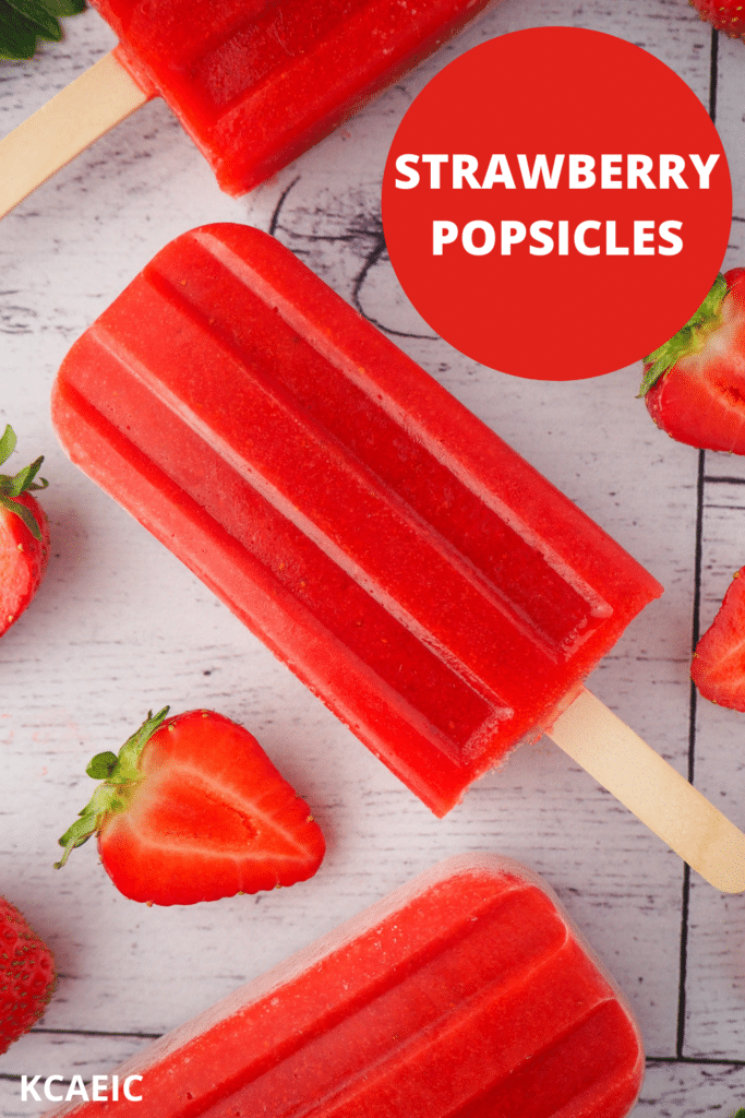 Strawberry popsicles in a vertical row, surrounded by fresh strawberries, with text overlay, Strawberry popsicles, KCAEIC.