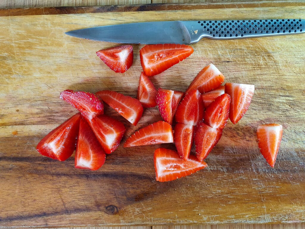 Slicing up strawberries.