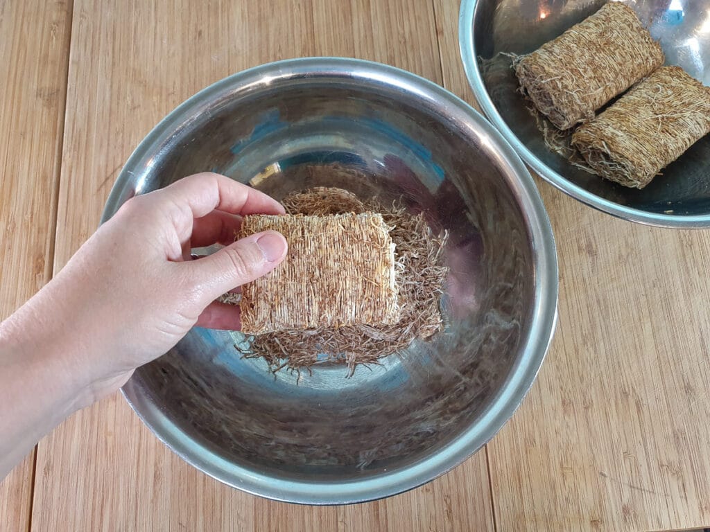 Breaking up shredded wheat.