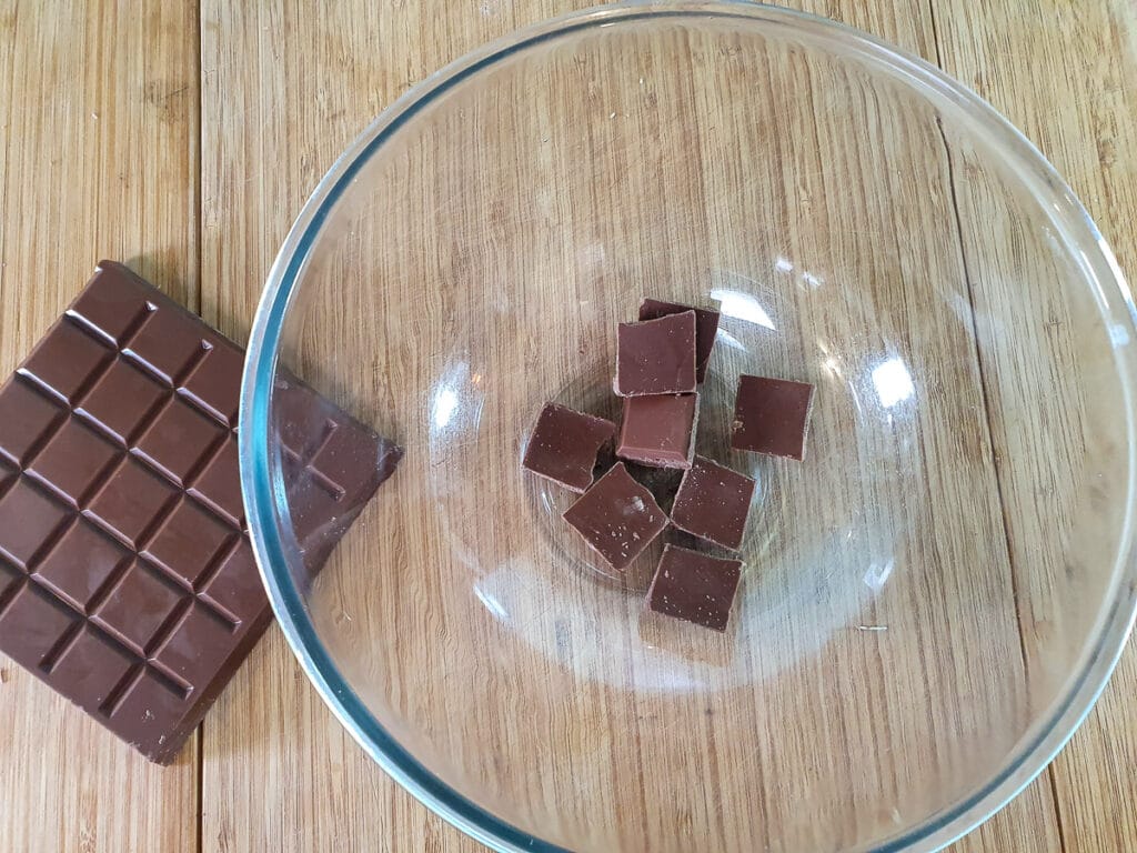 Breaking up chocolate into pieces.