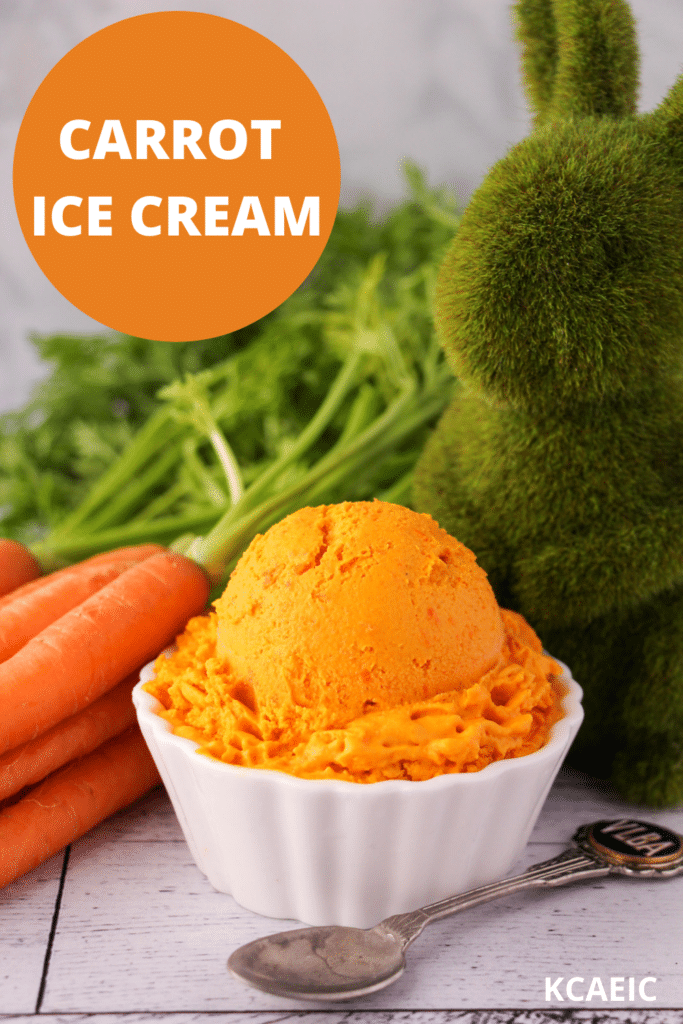 Scoop of carrot ice cream in a white bowl, with a vintage spoon and fresh Dutch carrots on the side, a green grass rabbit figure and text overlay, carrot ice cream, KCAEIC.