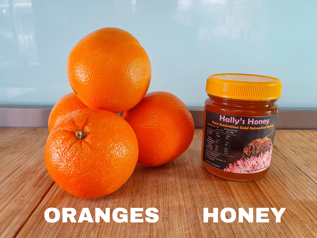 Orange popsicles ingredients, fresh oranges and honey.