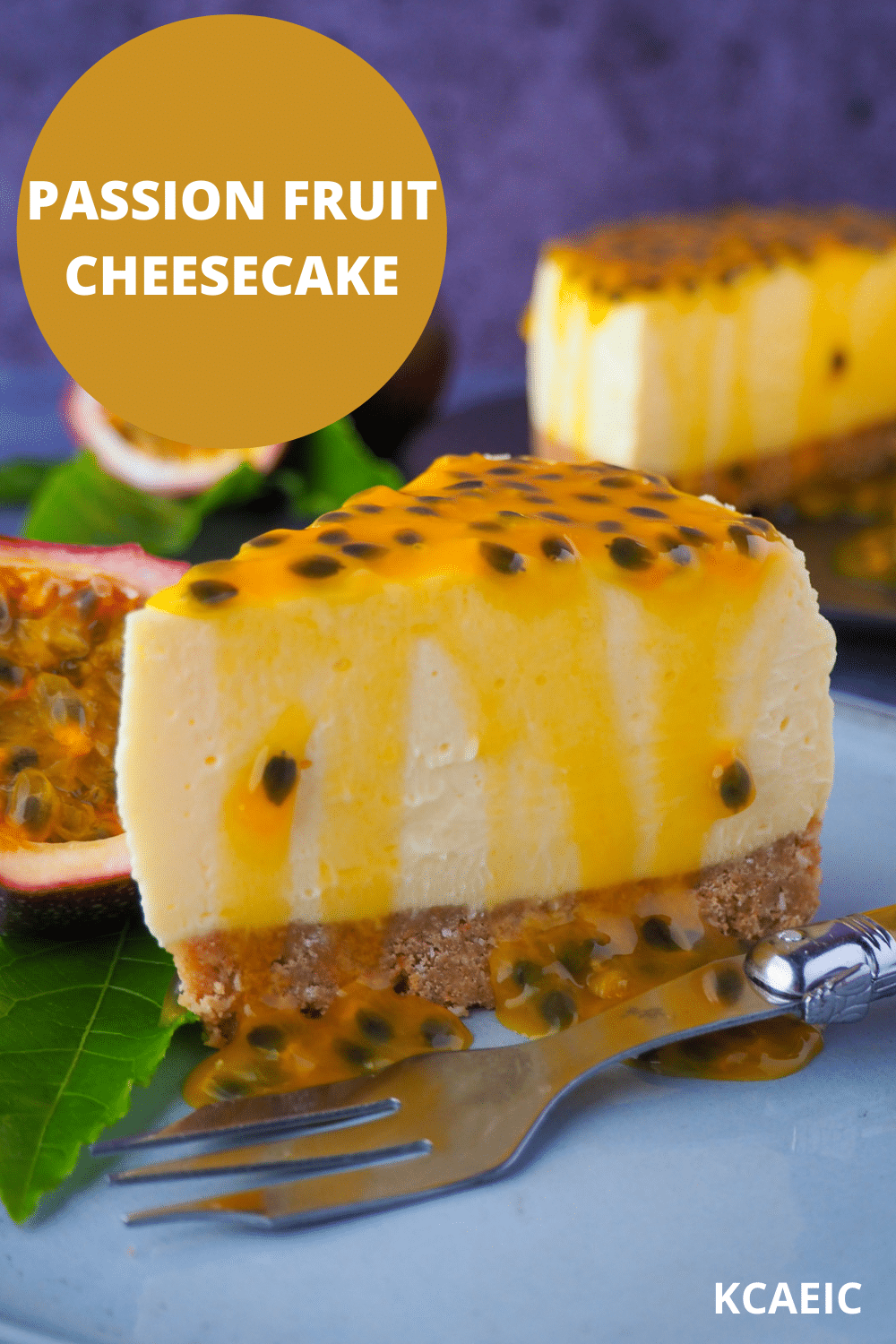 Passion fruit cheesecake 24 Passion fruit cheesecake with passion fruit coulis, a vintage fork in front, fresh passion fruit and passion fruit leave on the side, and rest of cheesecake in the background, with text overlay passion fruit cheesecake, KCAEIC.