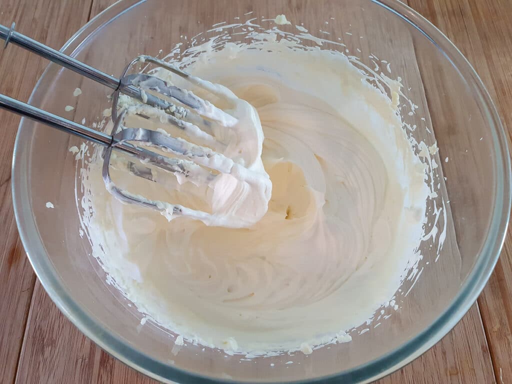 Whipping cream to soft peaks.