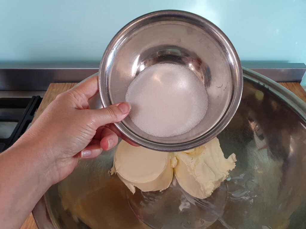 Passion fruit cheesecake 12 Adding sugar to room temperature cream cheese,