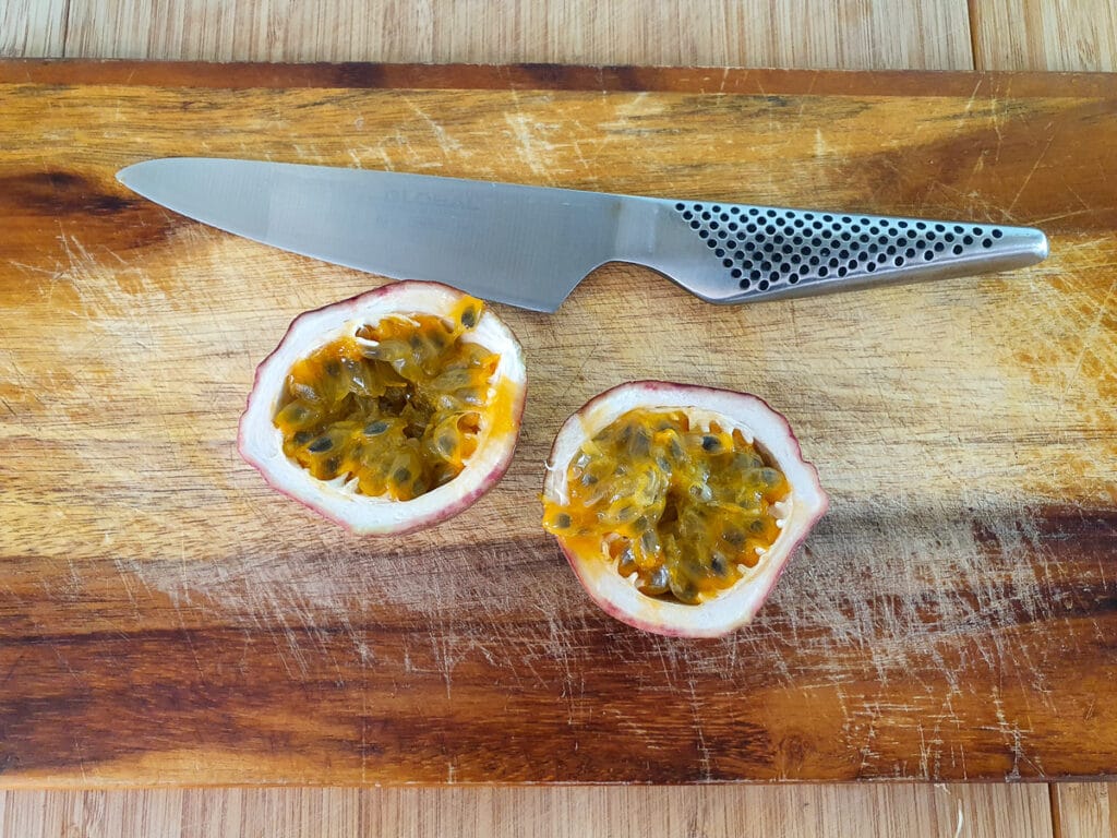 Slicing open passion fruit.