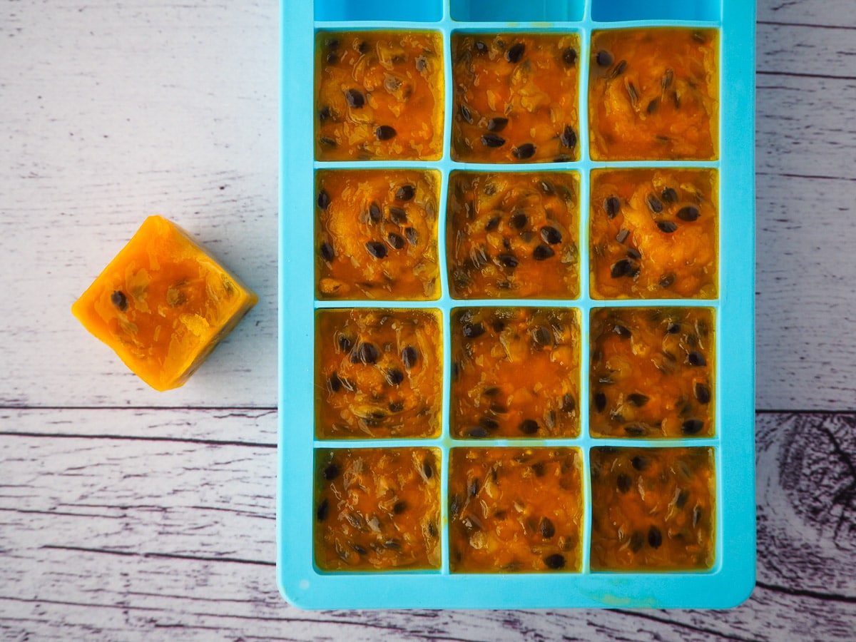 Passion fruit coulis frozen in individual serves in ice cube molds.