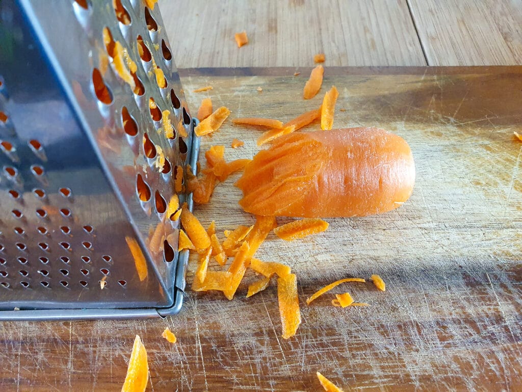 Grating carrot with the coarse side of a box grater.