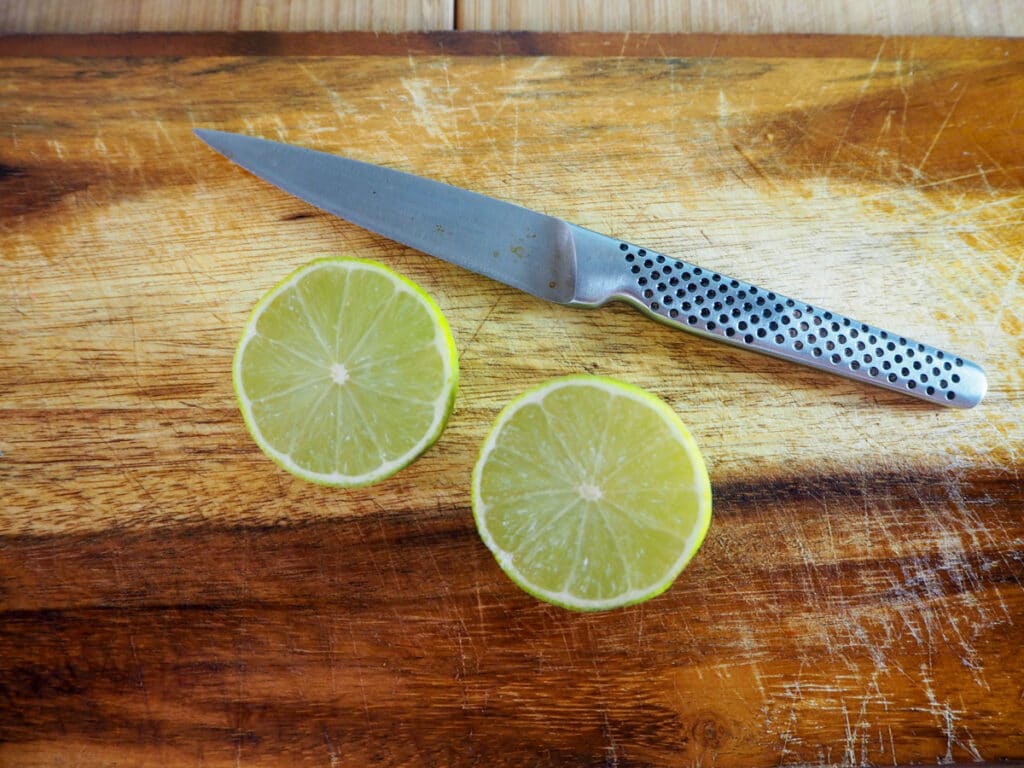 Slicing limes to juice.