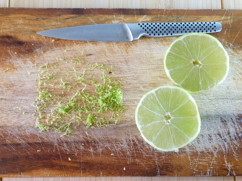 Zesting and slicing lime to juice.