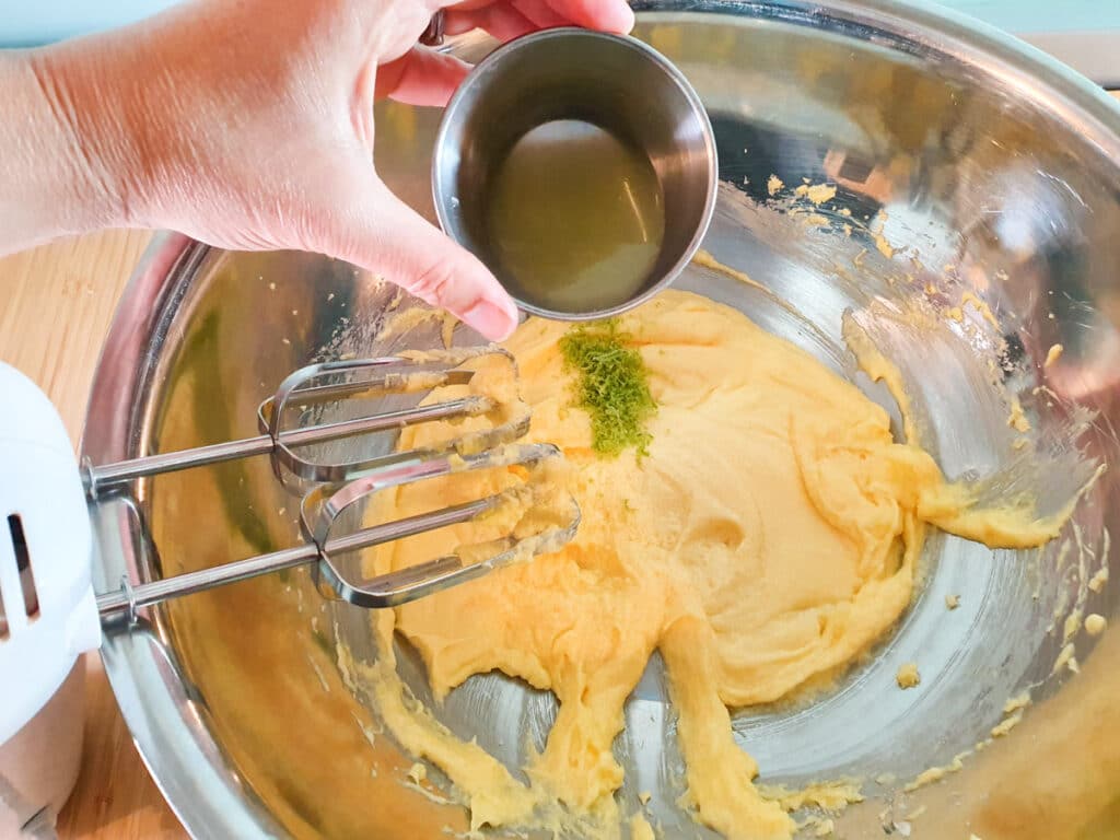 Feijoa cake 9 Adding lime juice and lime zest to butter, sugar and egg mix.