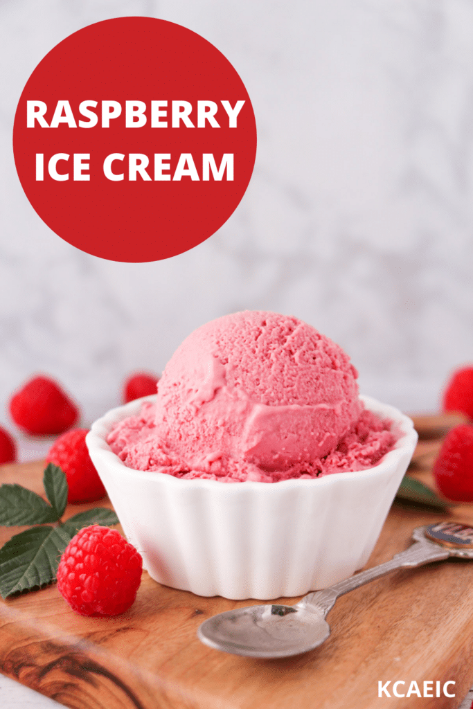 Scoop of raspberry ice cream in a bowl, with fresh raspberries and leaves on the side and a vintage spoon, with text overlay, raspberry ice cream, KCAEIC.