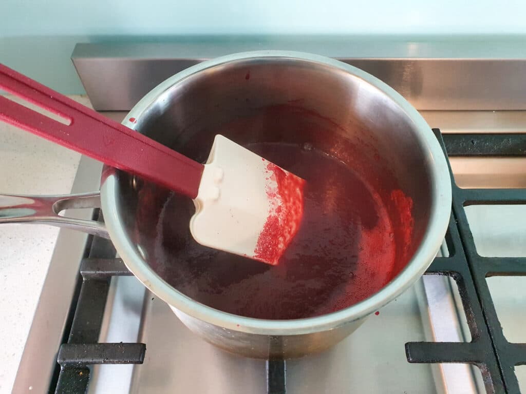 Reducing down raspberry puree.