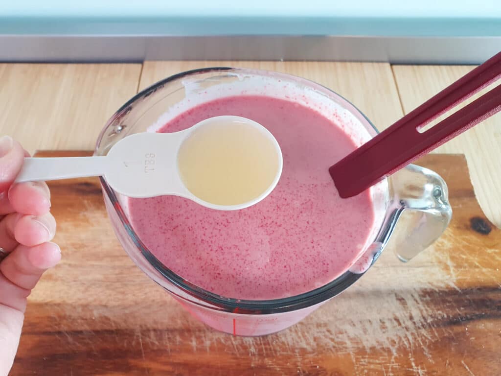 Raspberry ice cream 18 Adding lemon juice to ice cream mix.