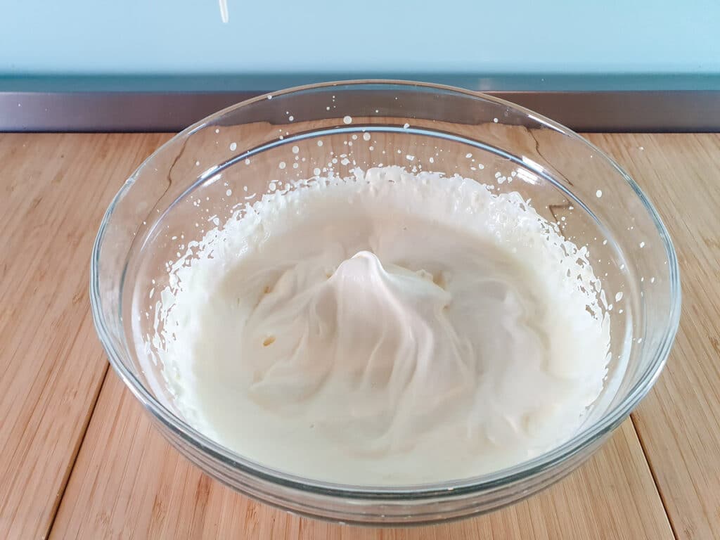 Thickened cream whipped to soft peaks.