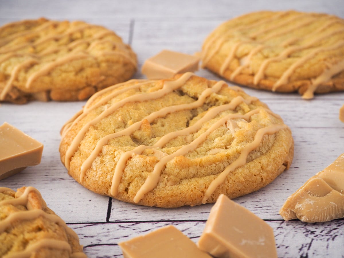 Caramilk cookies 15 Caramilk cookies surrounded by chunks of caramilk chocolate.