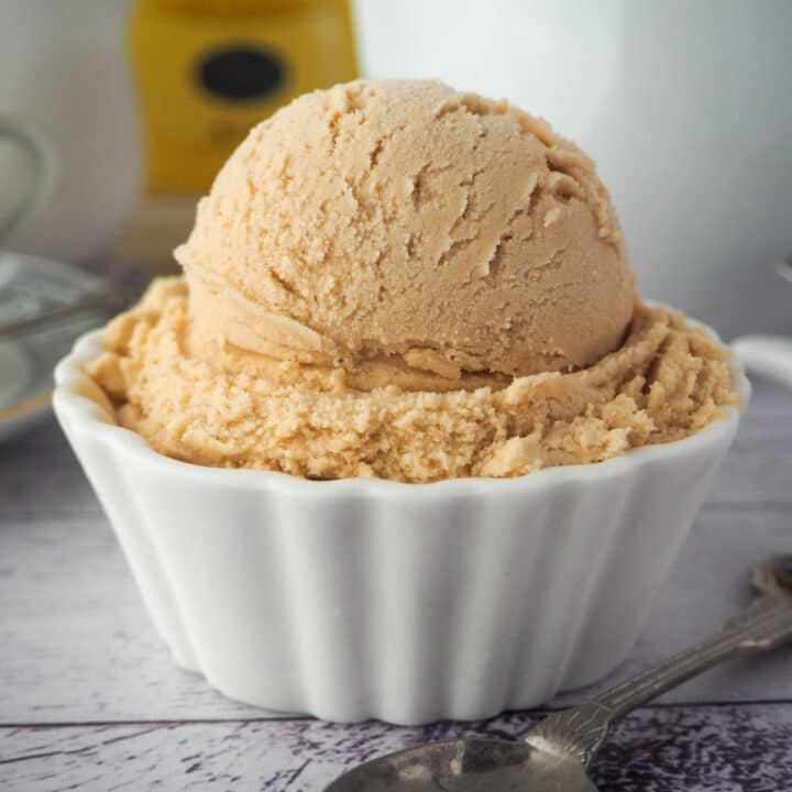 Close up scoop of earl grey ice cream with spoon.