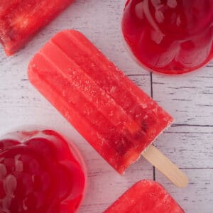 Jello popsicles 12 Close up of strawberry jello popsicle with mini strawberry jello molds.