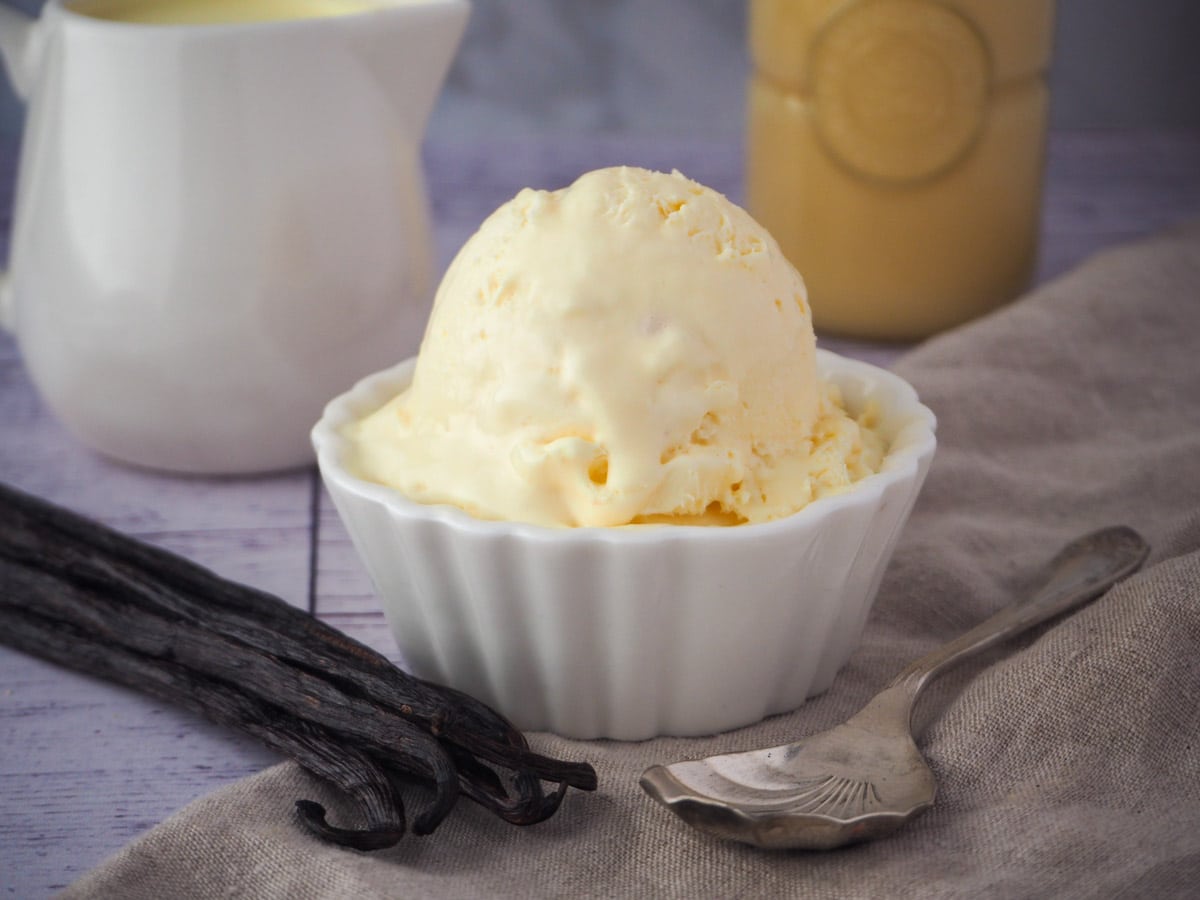 Ice cream with ingredients and spoon.