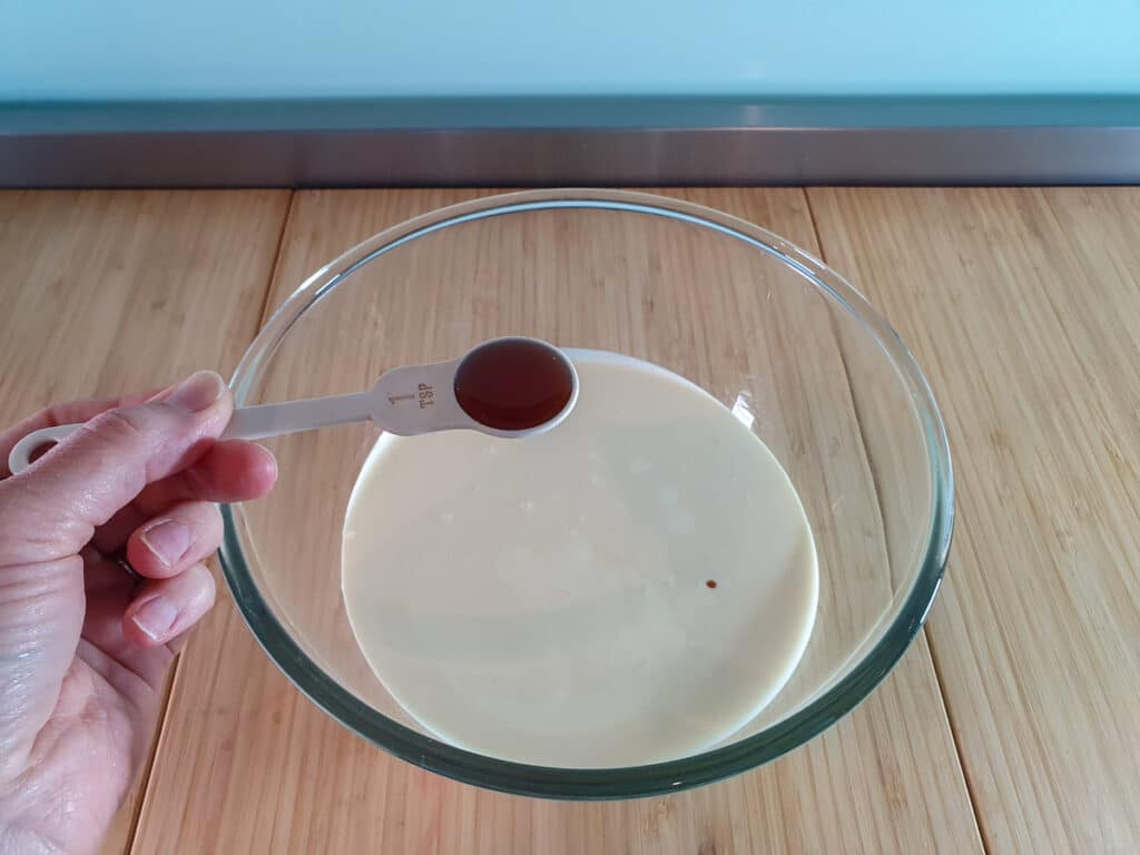 3 Ingredient Ice Cream 4 Adding vanilla to cream.
