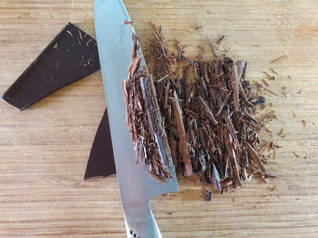 Chopping chocolate.