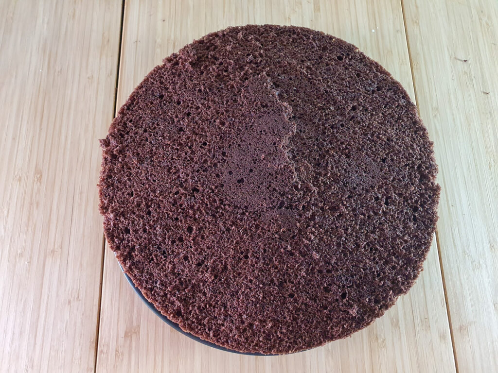 Traditional Black Forest Cake 28 Adding middle layer of cake.