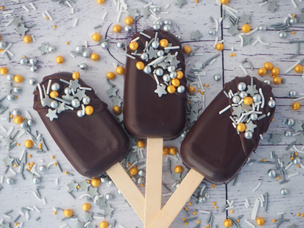 Silver, gold and dark chocolate cakesicles.