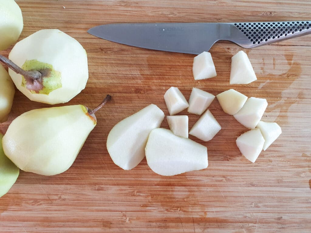 Peeling, coring and dicing pears.