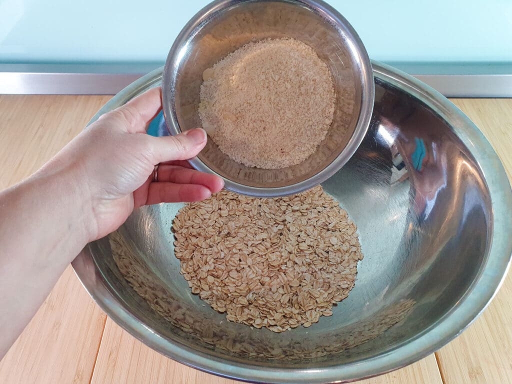 Adding almond meal to oats.