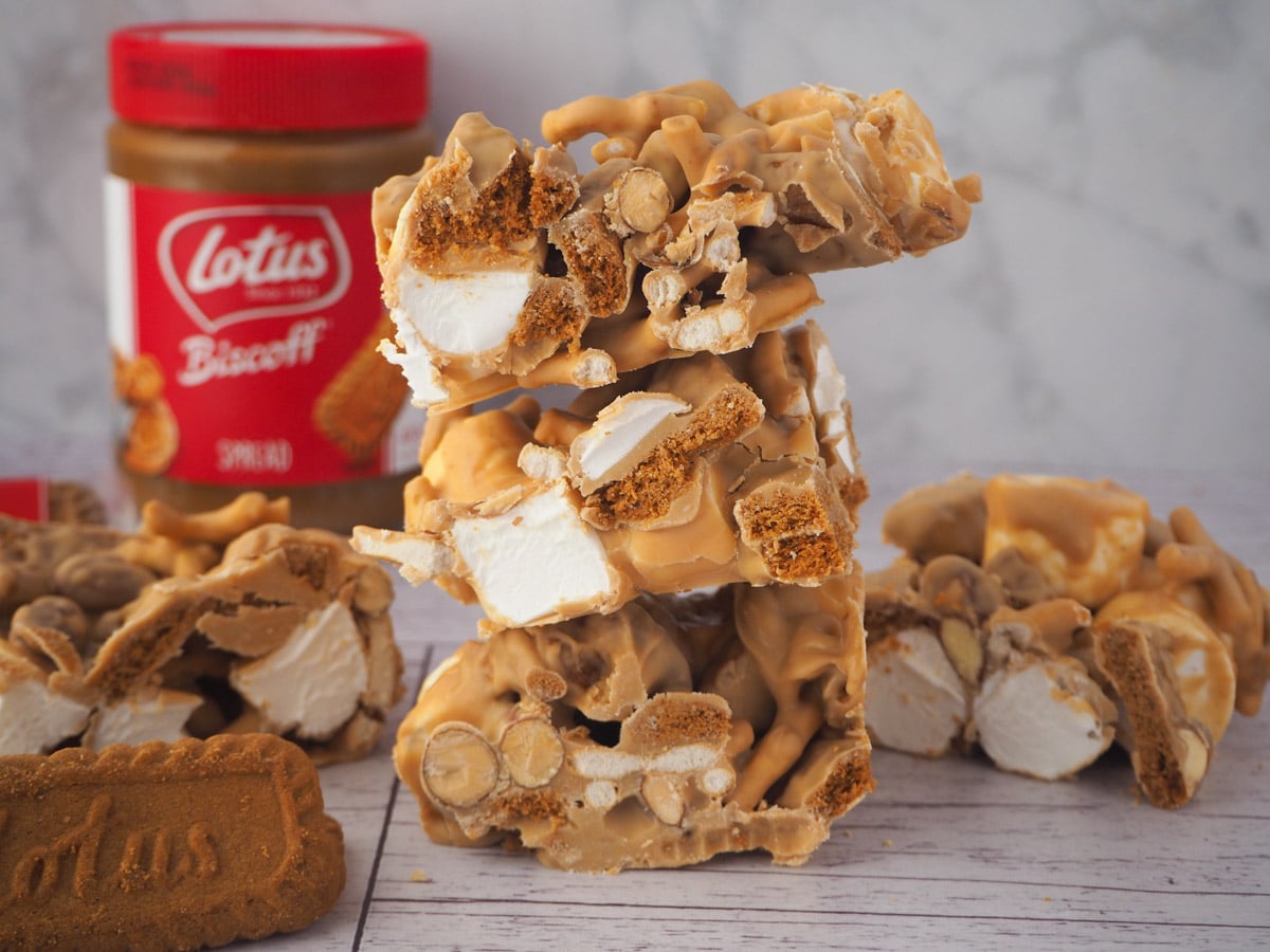Biscoff Rocky Road 13 Stack of rocky road with other pieces and Biscoff jar in back ground.