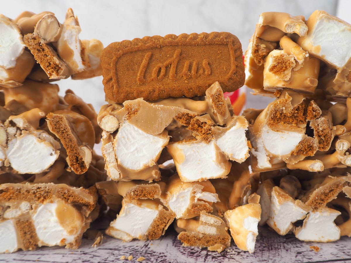 Stack of rocky road with Biscoff jar in the background.