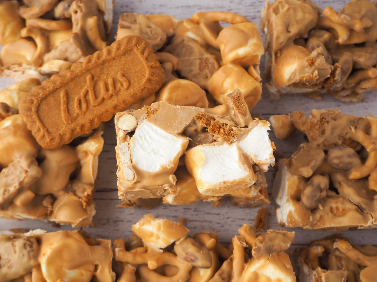 Biscoff Rocky Road 12 Flat lay of rocky road with one piece with cut edge facing up.