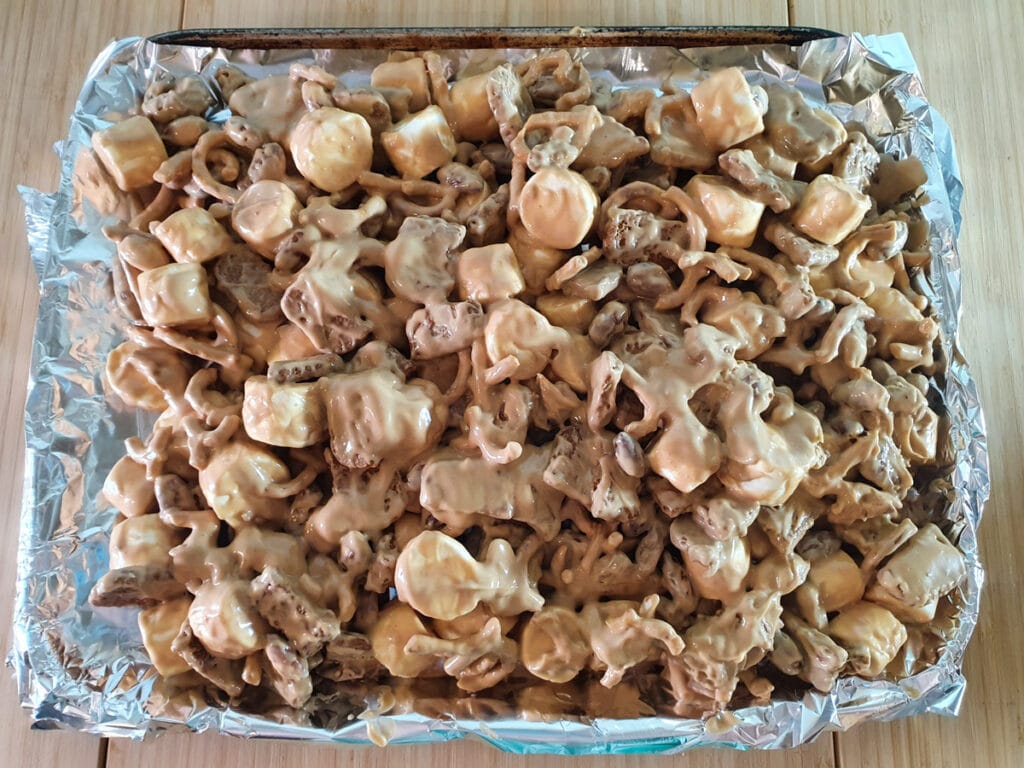 Biscoff Rocky Road 11 Spreading rocky road out onto lined tray to set.