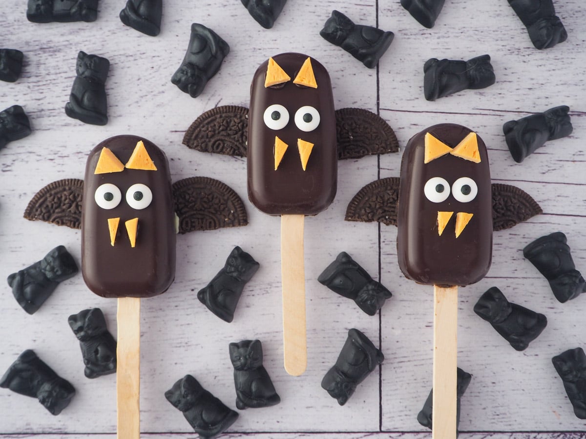 Halloween cakesicles 3 Row of three bat cakesicles surrounded by candy cats.