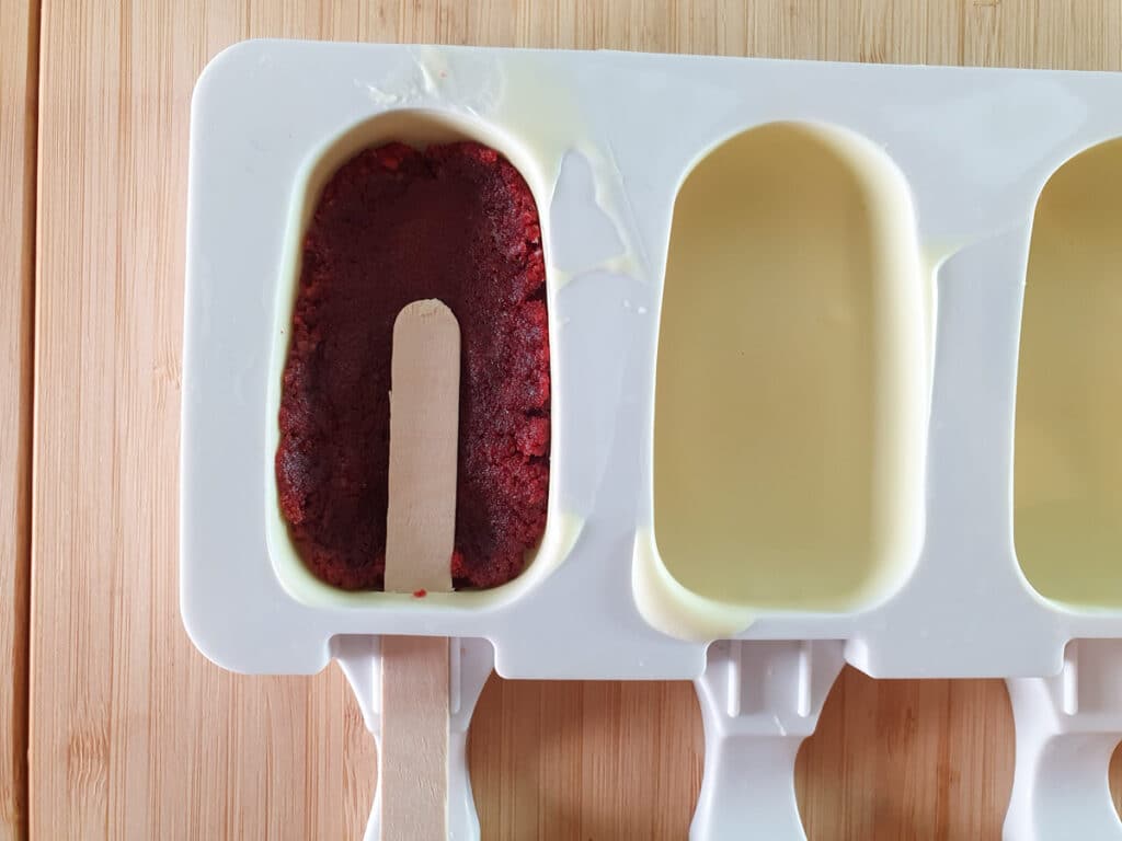 Halloween cakesicles 15 Add cake mix to bottom of mold and stick on top.